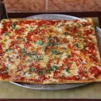 Grandma Pie · Thin crust focaccia square pizza made with Parmigiano cheese and fresh mozzarella with our s...