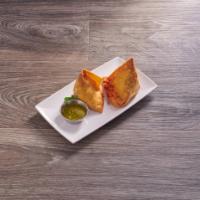 Vegetable Samosa · Pastry with vegetable stuffing. Served with hot, mild and mint chutneys.