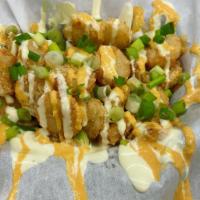 Tater Tot Crowns · Tater Tot Crowns covered in your choice of Chipotle Aioli or Peruvian Aioli with Rocoto, and...