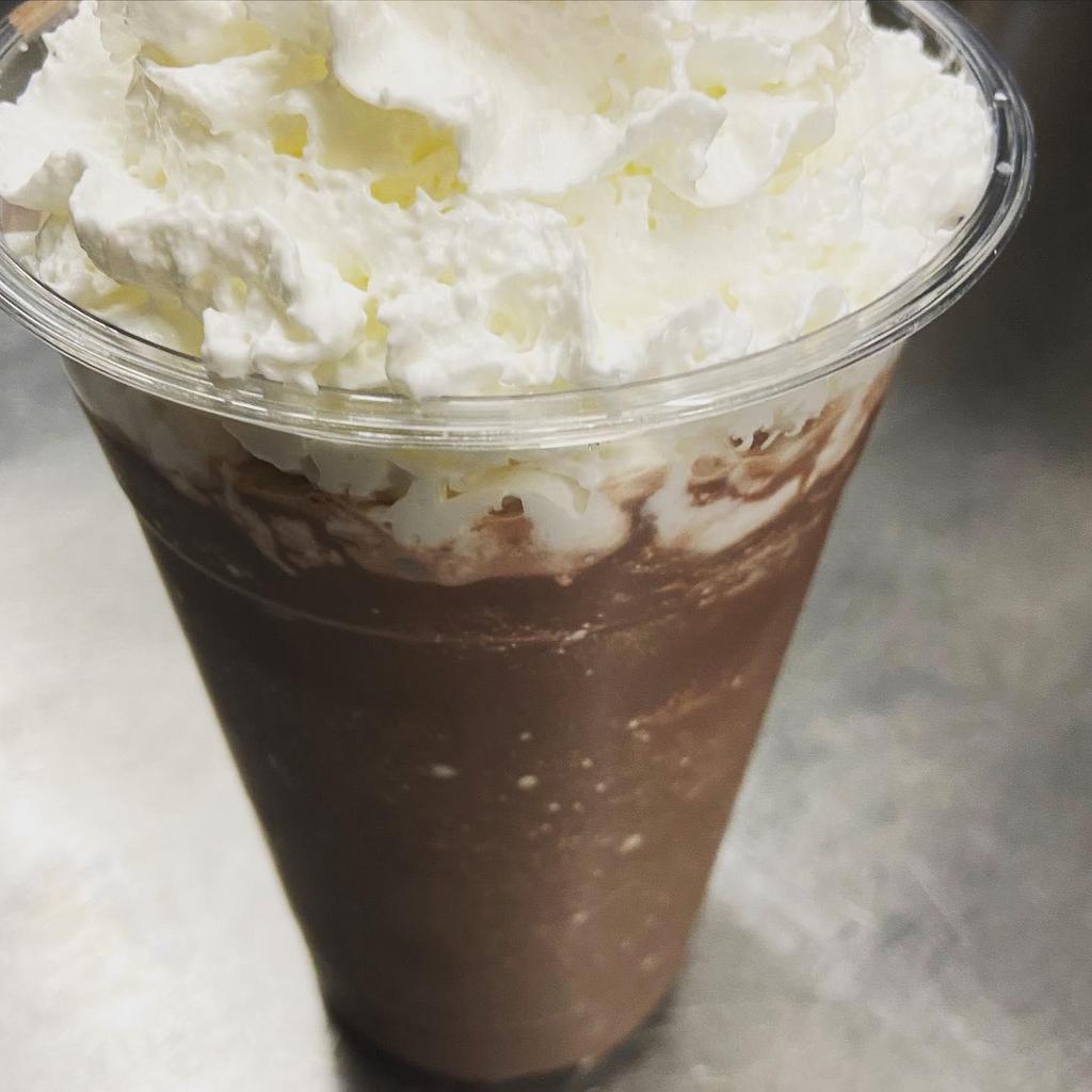 Frozen Hot Chocolate · A rich chocolaty frozen hot chocolate topped with velvety whipped cream. 
Like a frappe but sweeter and without any caffeine.