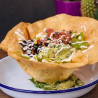 El Toro Salad · mixed greens, queso mixto, black bean & corn salsa, pico de gallo, guacamole, lime crema, to...