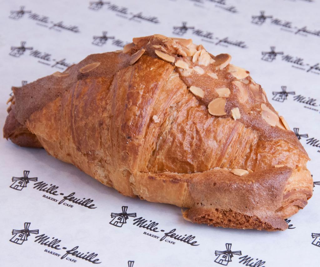 Almond Croissant · Made with locally sourced flour and hormone free butter.