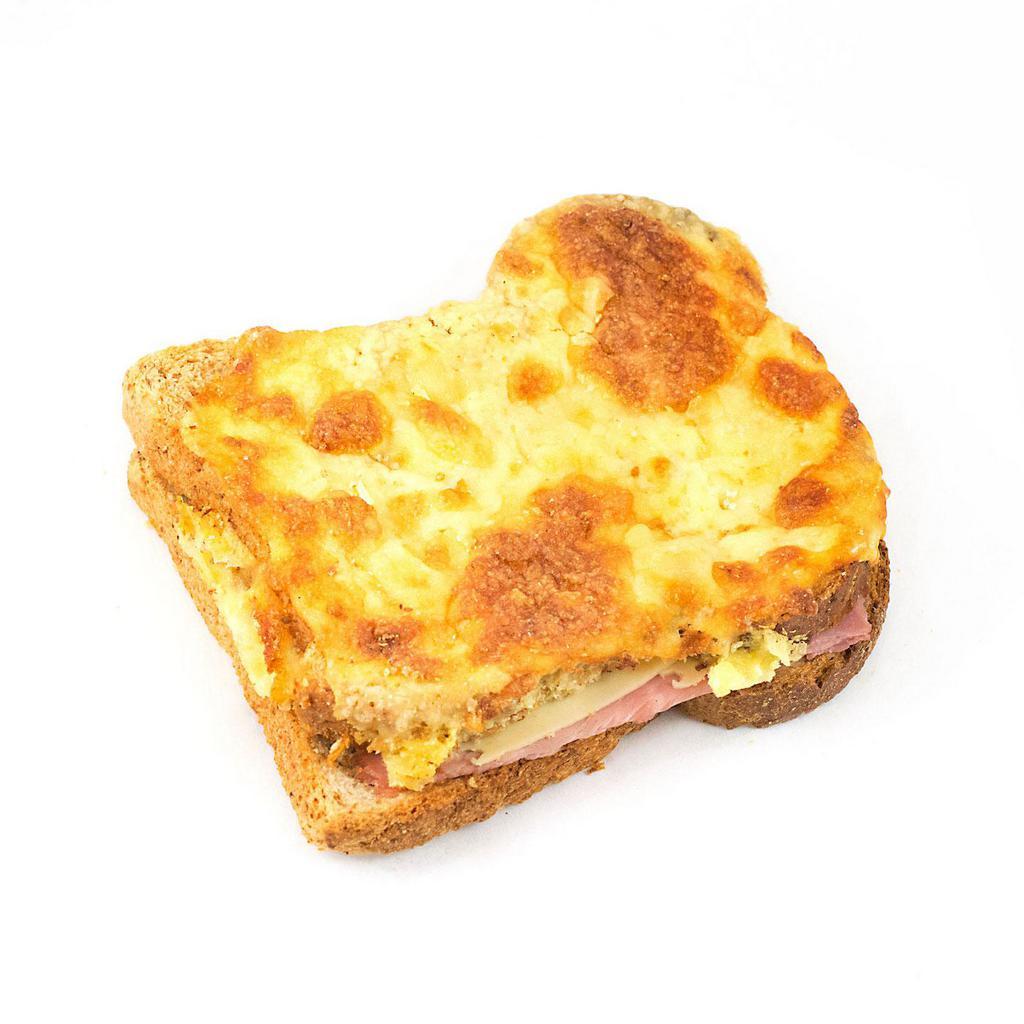 Croque Monsieur Sandwich · Whole wheat toast, bechamel sauce and all natural berkshire ham topped with cheddar cheese and Turkish nutmeg, salt and pepper.