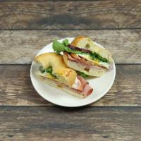Asiago Swiss Supreme Sandwich · Choice of ham or turkey with Swiss cheese, lettuce, tomato, mayo and mustard on an Asiago ba...
