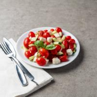 Caprese Salad · Freshly cut tomatoes, fresh water Mozzarella and basil tossed with extra virgin olive oil.