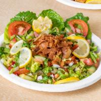 Fattoush Salad · Lettuce, tomato, cucumber, radish, onion, mint, sumac and toasted pita bread with either fre...