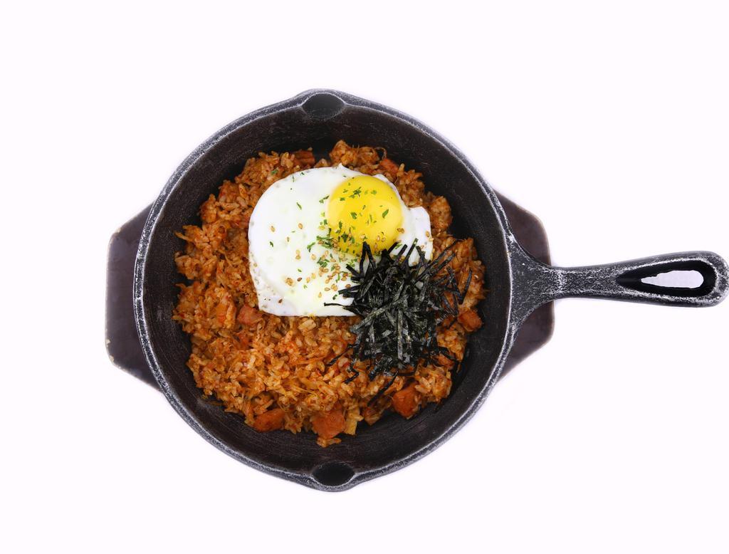 Kimchi Fried Rice · Stir fried kimchi and ham. Rice topped with a fried egg.