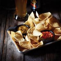Chips & Salsa · Freshly made white corn tortilla chips and our chipotle lime salsa.