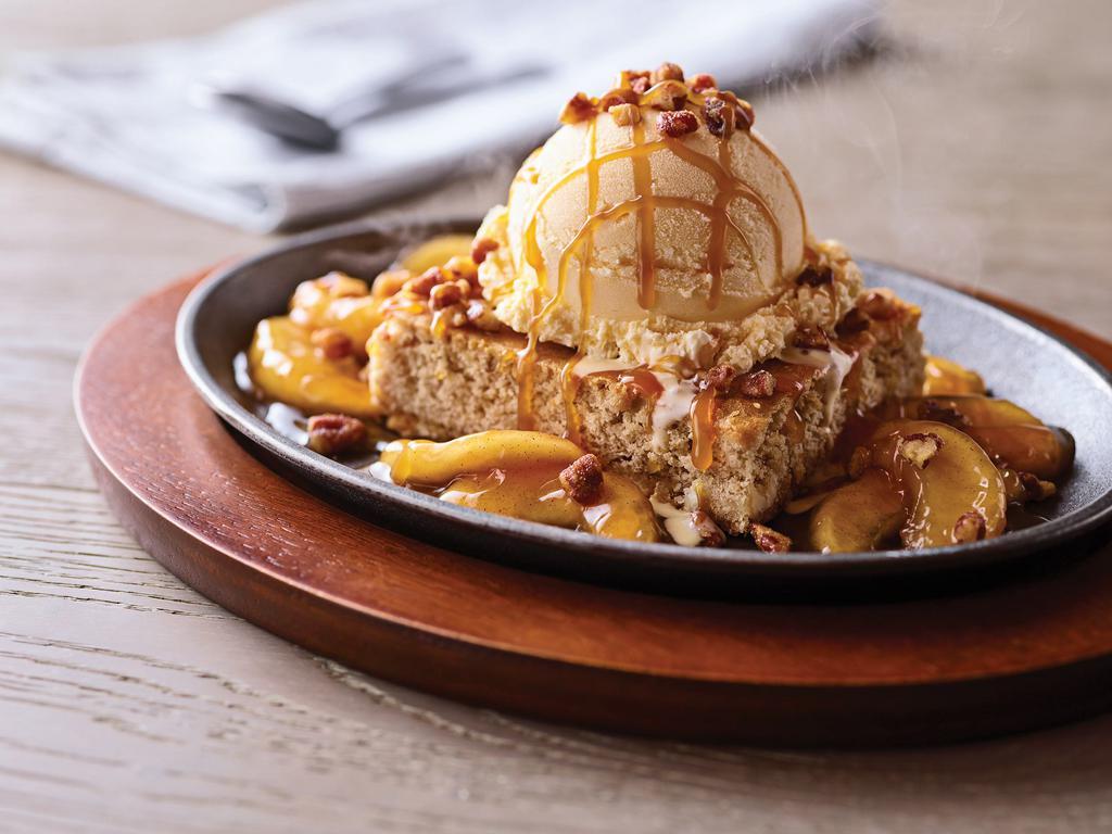 Sizzlin' Caramel Apple Blondie  · Cinnamon apples surround our famous butter pecan blondie topped with vanilla ice cream, sizzled and drizzled with caramel sauce and a sprinkle of candied pecans.