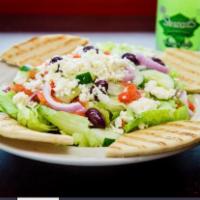 Greek Salad · Chopped lettuce, feta cheese, stuffed grape leaves, pepperoncini, olives, onions, tomato, sl...