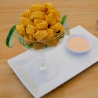 Calamares Fritos · Crispy fried calamari. Served with homemade pink sauce.