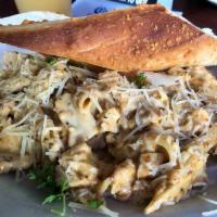 Alfredo Chicken Pasta · Grilled chicken breast with penne pasta tossed in our creamy alfredo sauce; finished with pa...