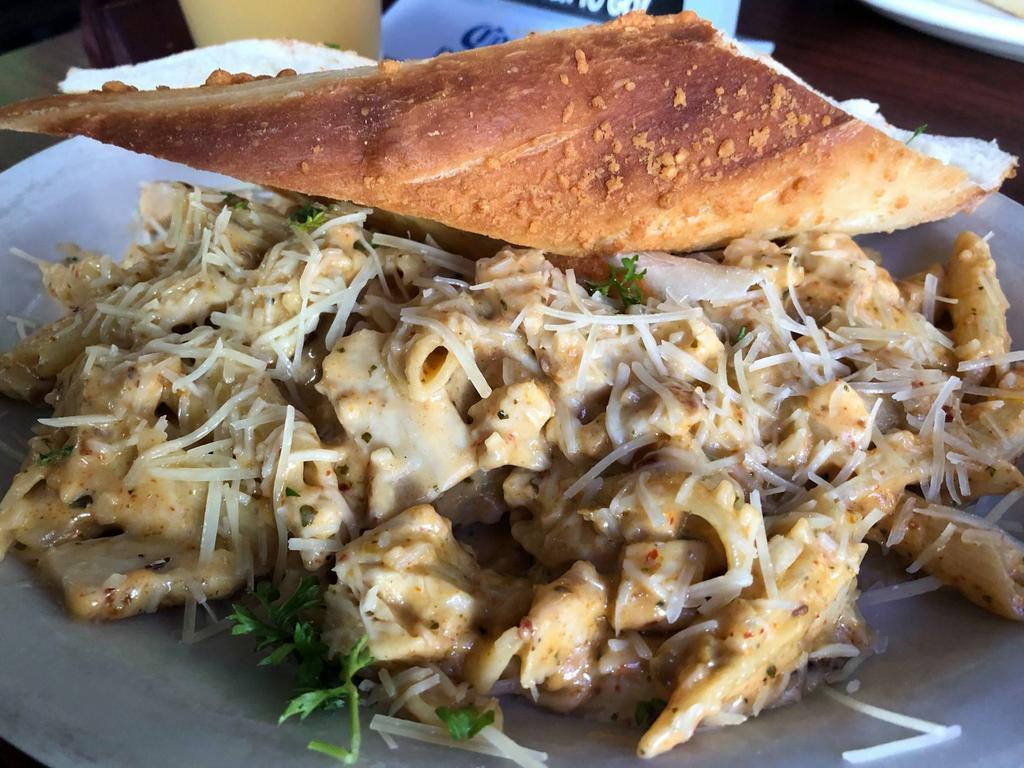 Alfredo Chicken Pasta · Grilled chicken breast with penne pasta tossed in our creamy alfredo sauce; finished with parmesan cheese.