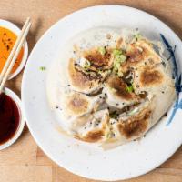 Veggie Dumplings  · Veggie dumplings filled with mushroom, fresh cabbage, and carrot. Includes dumpling sauce an...