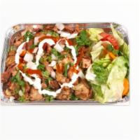 Chicken Over Rice  · Thinly sliced marinated chicken thighs grilled served with rice and salad.