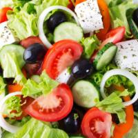 Greek Salad · Feta cheese, black olives, cucumber, parsley, red onions, bell peppers.