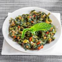 Spanich Sauteed · Sauteed spinach with tomatoes shallots and bell peppers. 