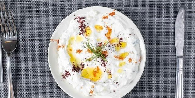 Cacik · Strained yogurt dip with cucumber, dried mint, dill and garlic.