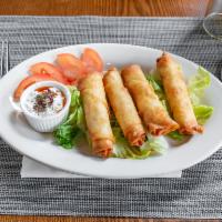 Cigar Borek · Pan-fried phyllo rolls, stuffed with feta cheese and parsley.