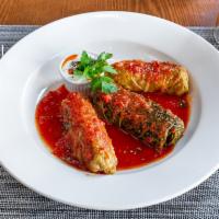Stuffed cabbage leaves · cabbage with rice and ground lamb served with garlic yogurt.