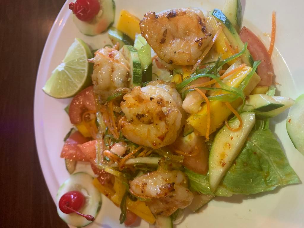26. Shrimp Salad · Grilled shrimp mixed with green salad, jacama, onion, tomatoes, cucumber, lime juice and mint. Hot and spicy.