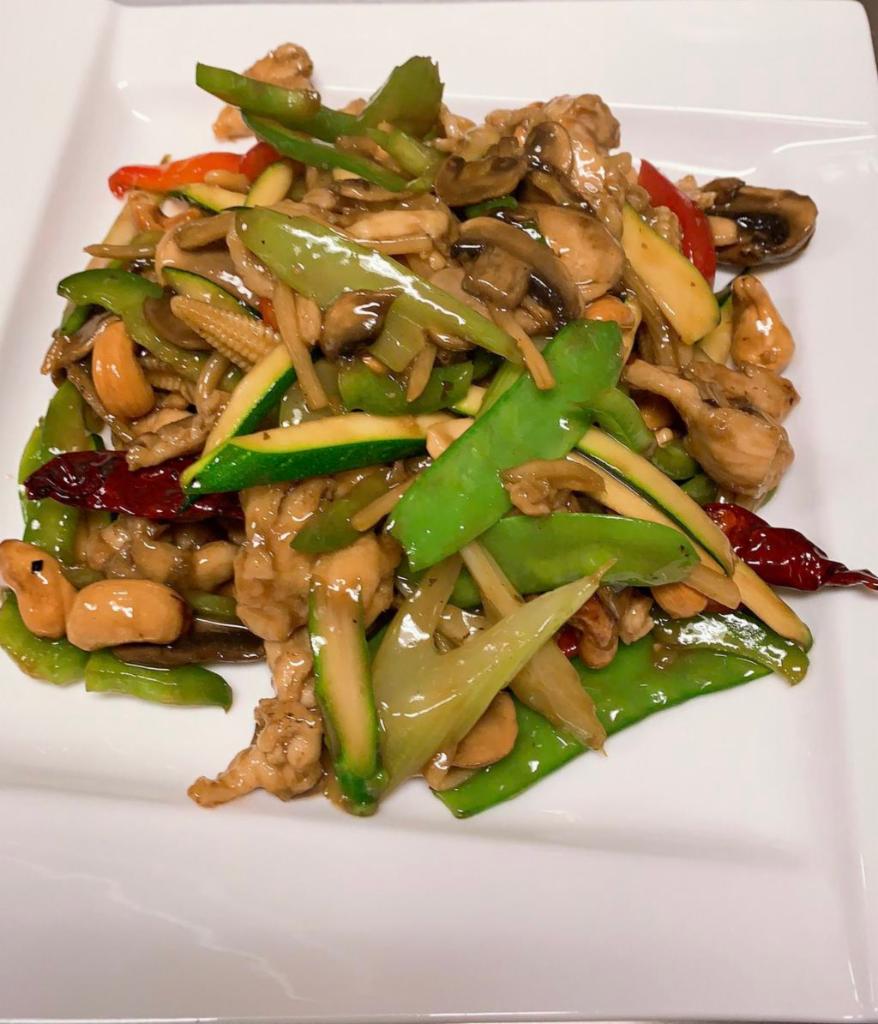 44. Cashew · Served with mushroom, belt pepper, bamboo shoots, celery, sweet peas, zucchini, asparagus, baby corn and dry hot pepper. Hot and spicy. Served with jasmine rice.