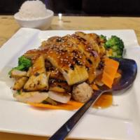 52. Thai Grilled Sesame Chicken · Grilled marinated chicken breast on a bed of mix vegetables and served with special brown sa...