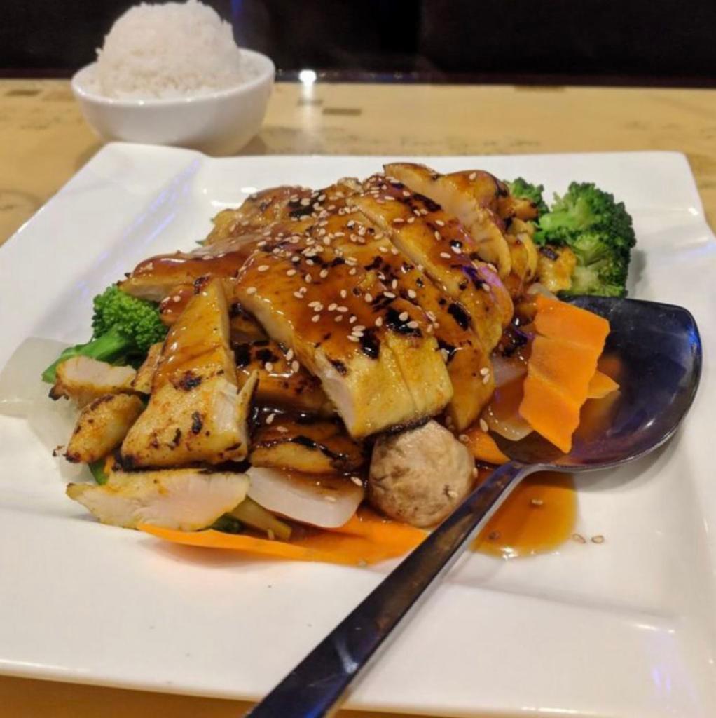 52. Thai Grilled Sesame Chicken · Grilled marinated chicken breast on a bed of mix vegetables and served with special brown sauce. Served with jasmine rice.