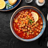Chana Masala · Chickpeas simmered in a tomato stew served with a side of basmati rice. Vegan. Gluten free.