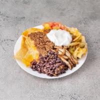 87. Super Nachos · Chicken, chili and sour cream. Homemade yellow corn tortilla chips covered with melted chees...