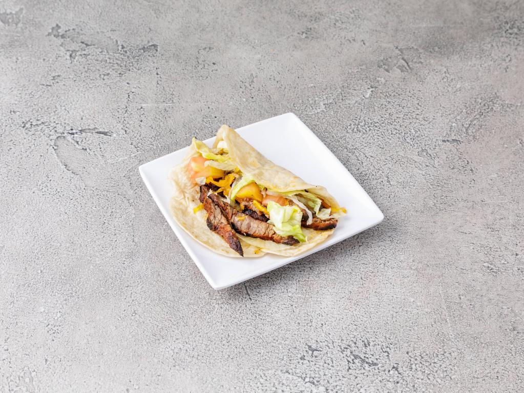23. Steak Taco · Served with iceberg lettuce, tomato and topped with cheddar cheese.
