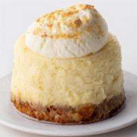 Vanilla Cheesecake to go · Rich vanilla bean cheesecake finished with a graham cracker crust.