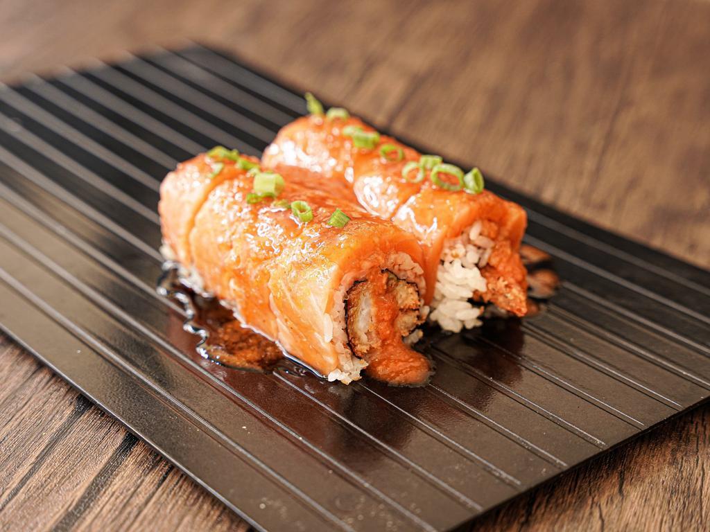 Fire Dragon Roll · Shrimp tempura and avocado topped with salmon and spicy special sauce.