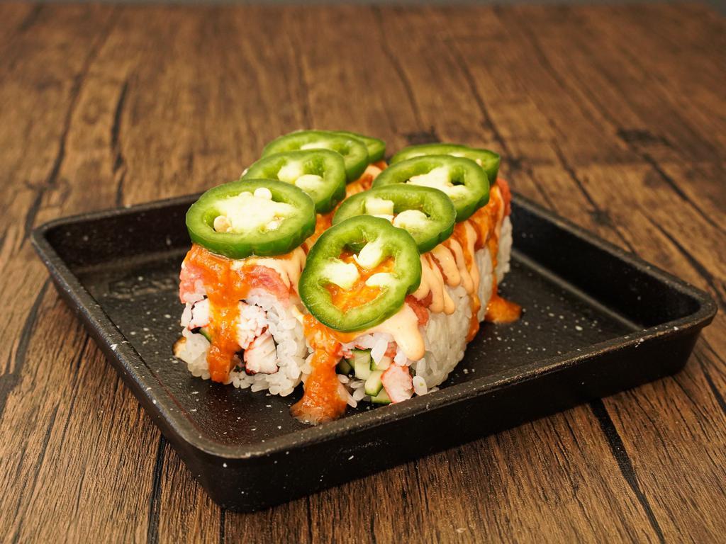 Super Fire Roll · Crab and cucumber topped with spicy tuna, special spicy sauce, and jalapeno.