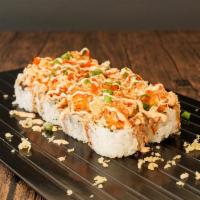 Volcano Roll · Crab tempura, avocado topped with crunch, spicy lobster, and masago with spicy mayo and spec...