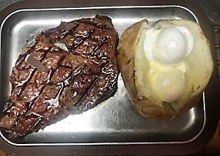 10 Ounce Select Cut Ribeye · 10 ounces of select cut ribeye with just enough marbling for that perfect flavor.  Includes your choice of potato, roll and side garden salad.