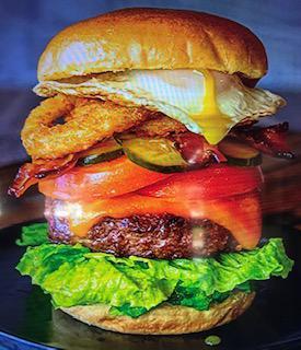 1/2 Pound Hangover Burger · Fresh steak burger cooked to your choice of doneness topped with sliced cheddar cheese, bacon, fried onion rings and a fresh fried egg.  Served on a toasted bun.
