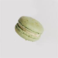 Pistachio Macaron · Mint green pistachio shell with crushed pistachio filled with pistachio buttercream.