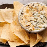 Spinach-Artichoke Dip  · Creamy white American and Asiago cheeses, spinach, grape tomatoes and roasted artichokes, to...
