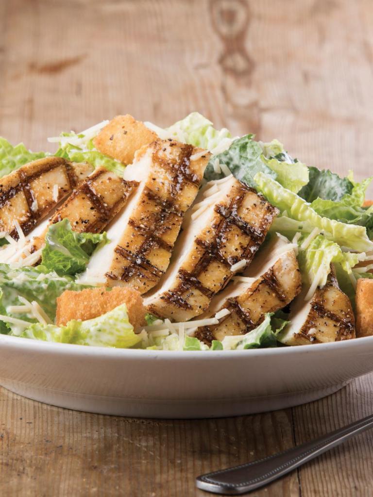 Grilled Chicken Caesar Salad · Grilled chicken, romaine lettuce, Parmesan cheese and croutons tossed with Caesar dressing 
