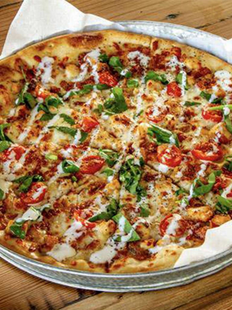 Chicken Bacon Ranch Pizza · Grilled chicken, applewood bacon, spinach, grape tomatoes and mozzarella cheese drizzled with ranch dressing 