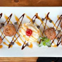 Deep-Fried Cookie Dough · Deep-fried battered cookie dough with a warm, gooey center, topped with chocolate and carame...