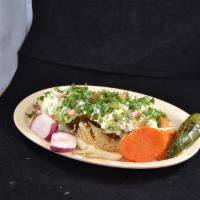 13. Huarache · Corn masa topped with meat, veggies, Mexican cheese, sour cream, beans, and guacamole