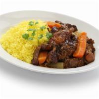 Stew Oxtail · Rabo guisado. Served with yellow or white rice, stew beans, fried green plantain or sweet pl...
