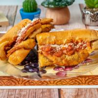 Eggplant Parmigiana Hero. · Deep fried breaded eggplant topped with Homemade tomato sauce mozzarella and parmesan cheese...