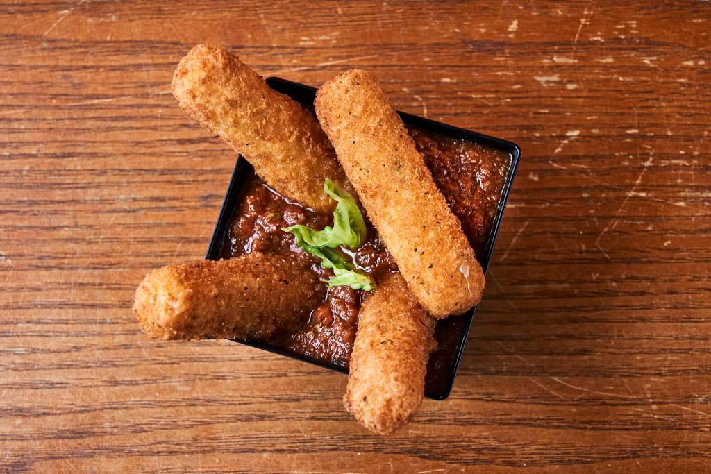 Mozzarella Sticks  · Seasoned and breaded mozzarella sticks served with a side of marinara sauce