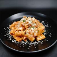 Bolognese (House Specialty) · house-made bolognese, parmesan reggiano, parsley, organic rigatoni pasta
