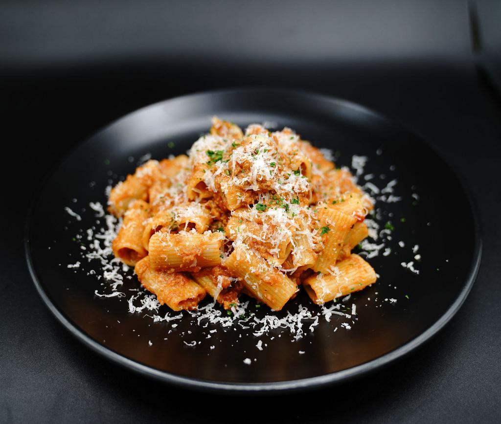 Bolognese (House Specialty) · house-made bolognese, parmesan reggiano, parsley, organic rigatoni pasta