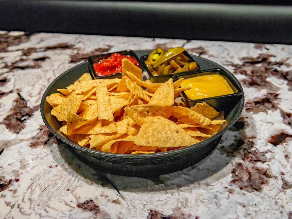 Nachos · Served with jalapenos, salsa, and nacho cheese.