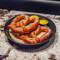 2 Soft Pretzels · 2 large soft pretzels served with choice of nacho cheese, honey mustard, or mustard.